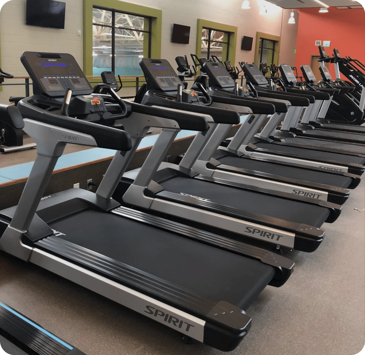 Man talking to woman in workout facility