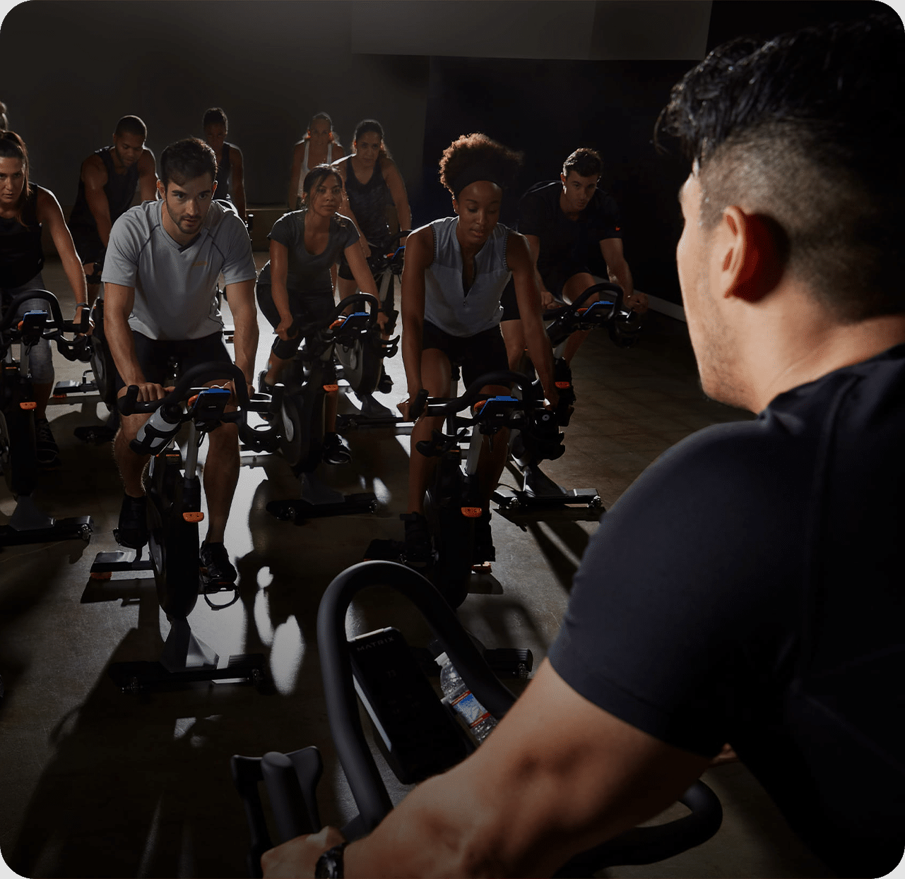 Man talking to woman in workout facility